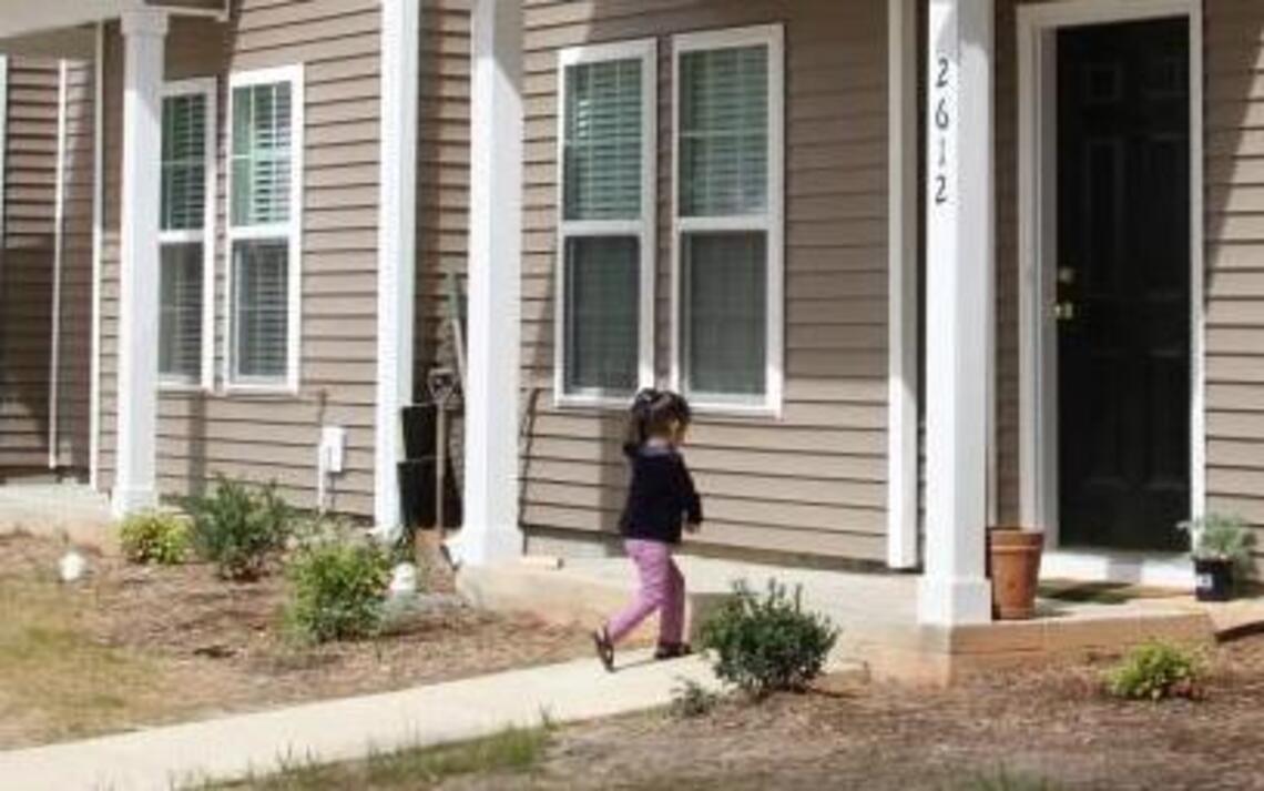 After nearly 20,000 volunteer hours, 11 families have a place to call home