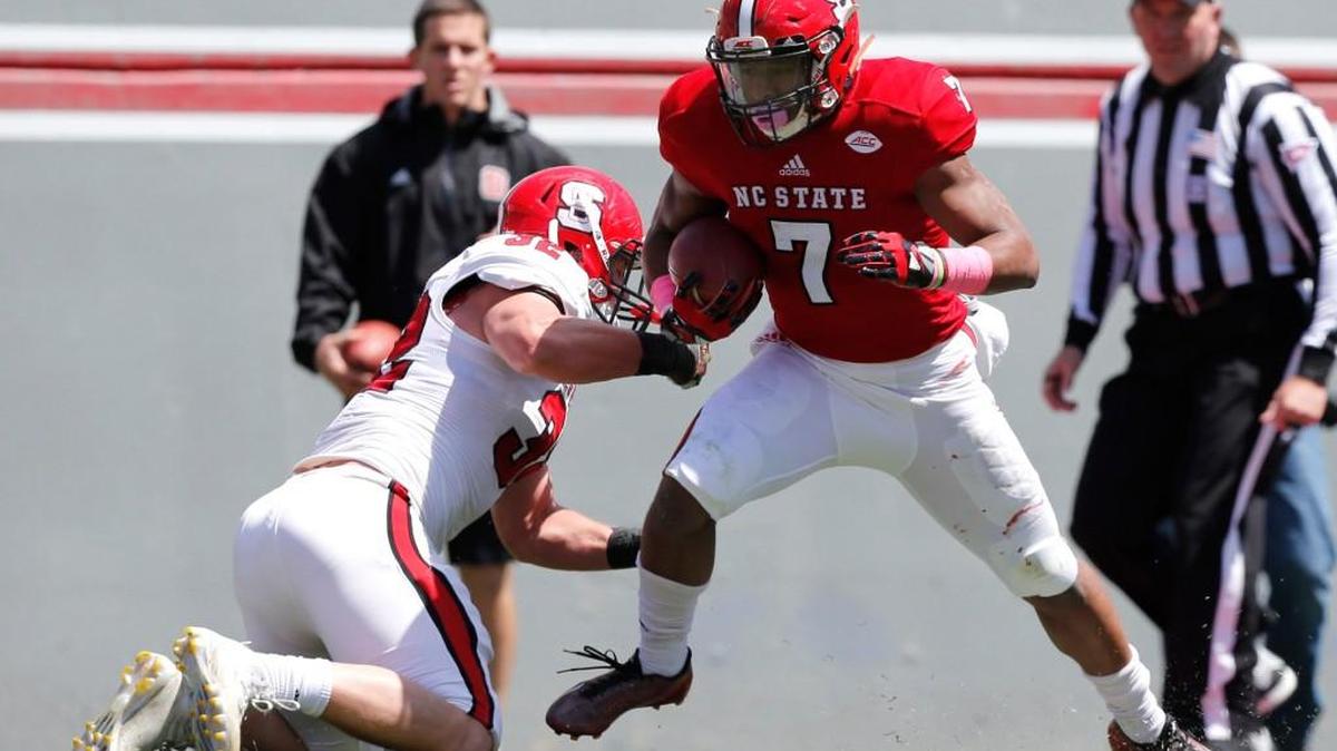 N.C. State’s Nyheim Hines (7) breaks free from linebacker Riley Nicholson (32) during the Kay Yow Spring Game at Carter-Finley Stadium in Raleigh on April 9.
