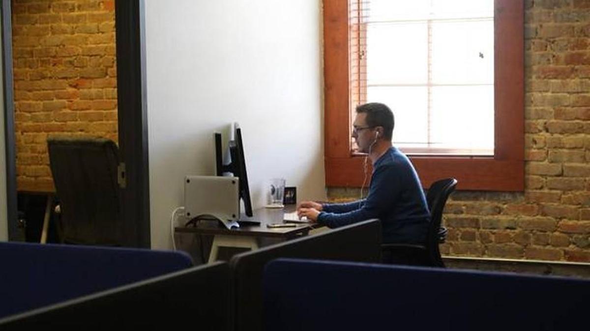 Dave Macpherson, a Holly Springs business development consultant, works at his new desk in April. Macpherson used to drive to work at The Frontier, a co-working space in Research Triangle Park, before the Coworking Station opened.