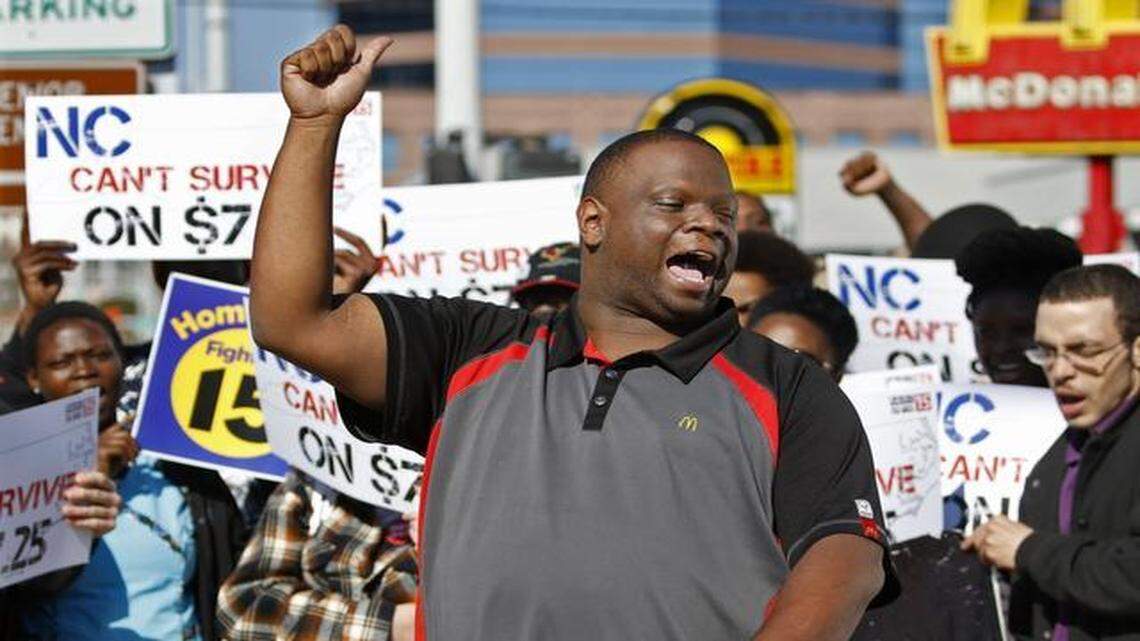 
Protestor George Hargrove, a McDonalds worker in Durham, NC leads a strike chant for the Raise Up 4/15 protest with other low wage workers at a Wednesday morning, April 1, 2015 curbside protest in front of the McDonald's in downtown Durham, NC. The group of about 25 protestors announced that NC fast-food workers and others will strike to fight for $15/hour wages at 5pm at Shaw University, Raleigh on Wednesday, April 15, 2015 in a mass rally.
