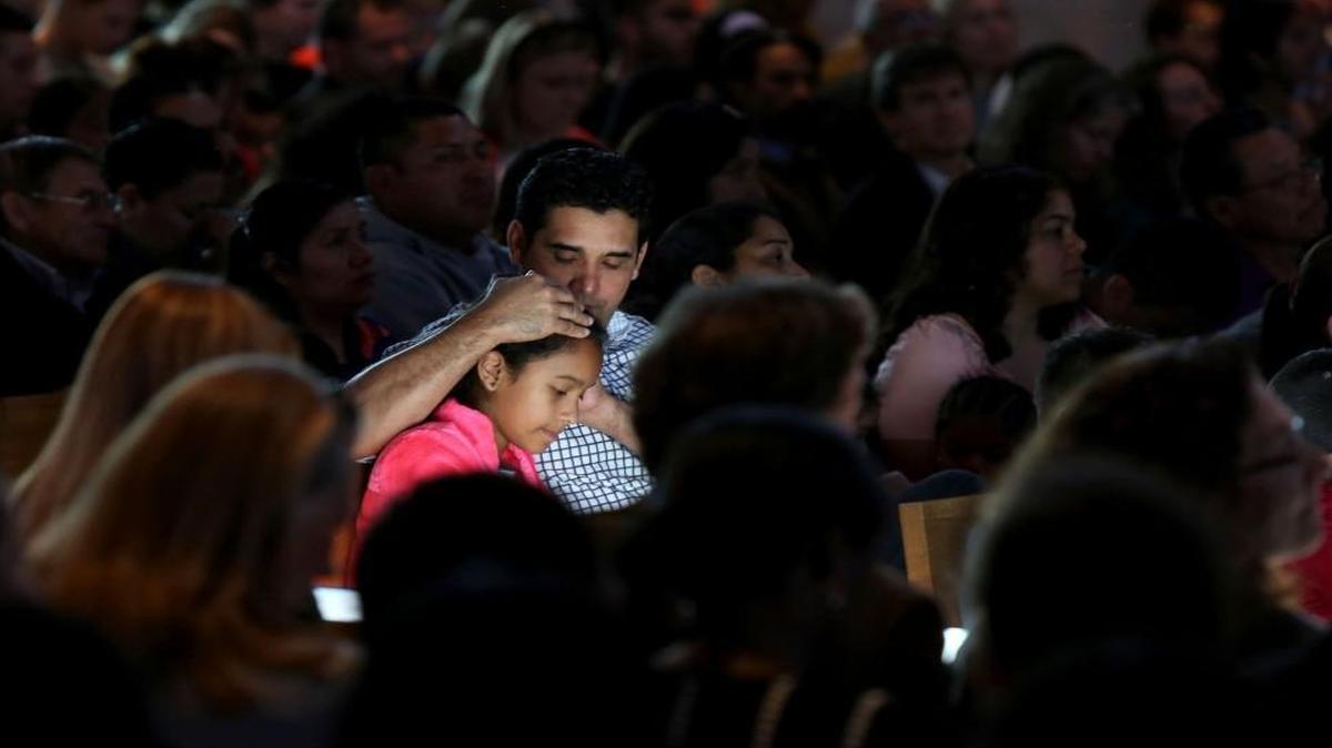 Rafael Mejia embraces his daughter, Danna Mejia, 11, during a forum hosted by Durham C.A.N. and the N.C. Congress of Latino Organizations at Immaculate Conception Catholic Church on Sunday, March 5, 2017. Officials representing Durham’s law enforcement agencies, city, county and school governments were invited to clarify the way authorities will interact with immigrants in the current environment.