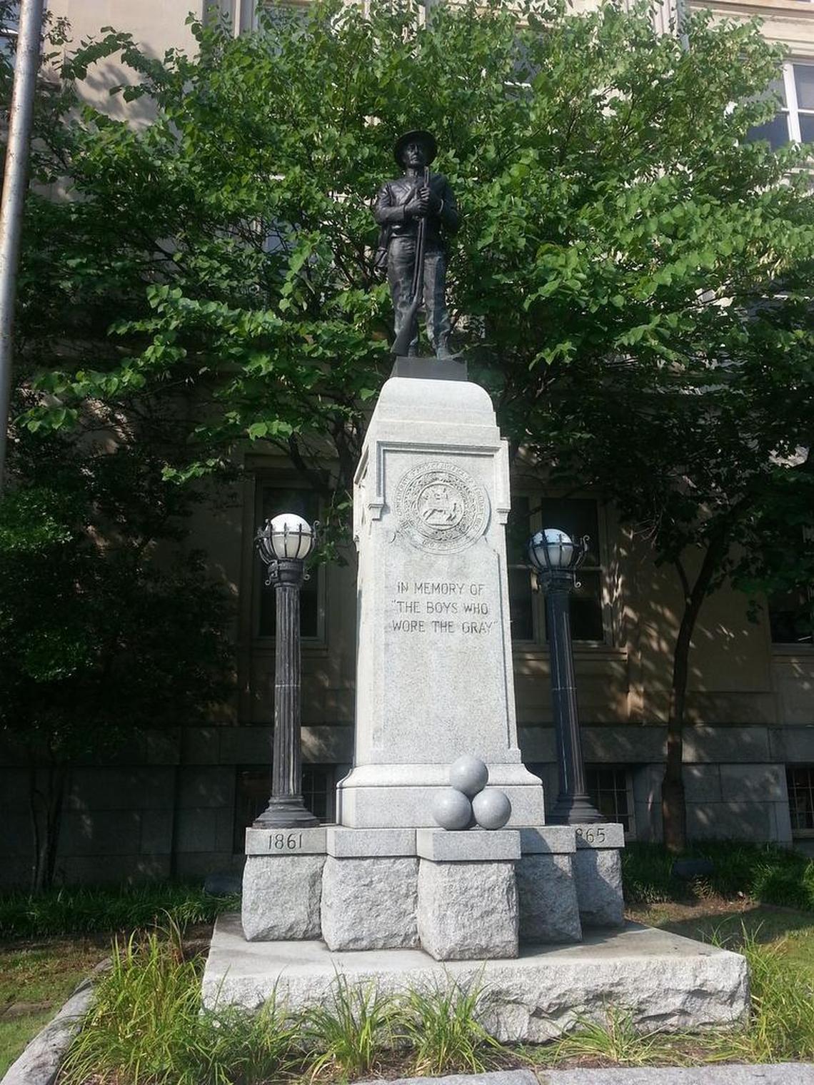 Protesters pulled down this 15-foot-tall statue of a Confederate soldier Monday night, Aug. 14, 2017, on East Main Street in downtown Durham. Durham citizens erected and dedicated the statue on May 10, 1924, in memory of “the boys who wore the gray.”