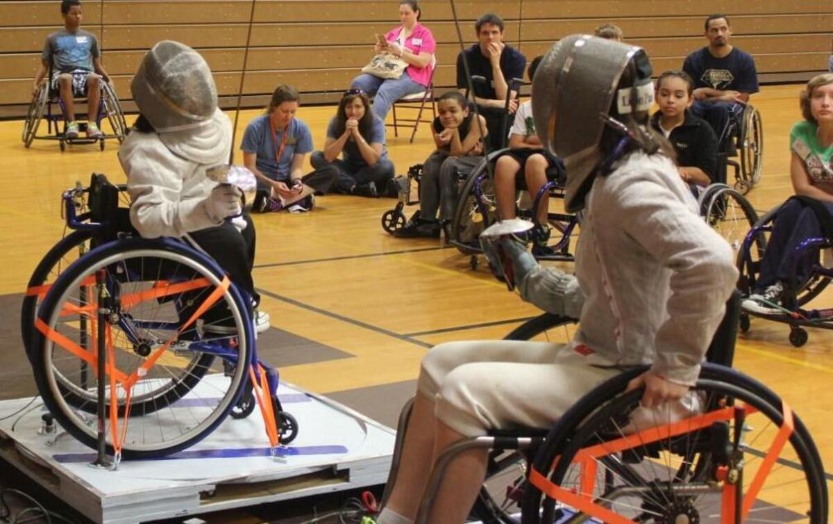 Athletes show off their fencing skills during a wheelchair fencing program at Bridge II Sports’ Paralympic Experience, an event in which the nonprofit demonstrates several adaptive sports.