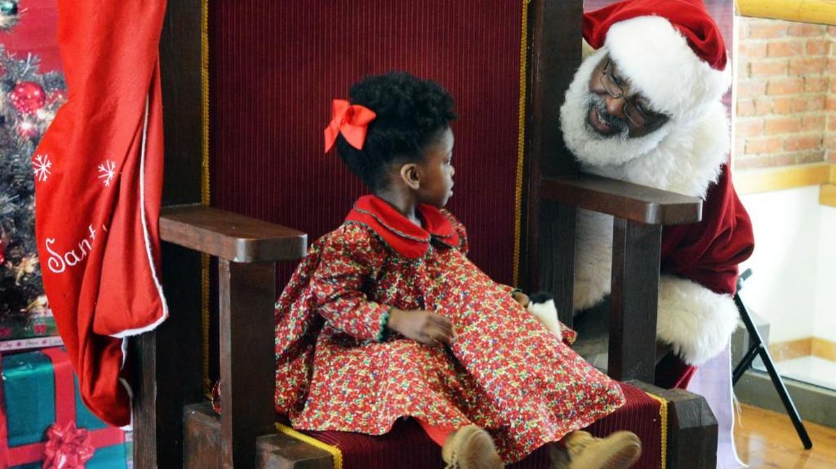Sabina Johnson traveled with her mom, Meisha, from Virginia to meet a black Santa.