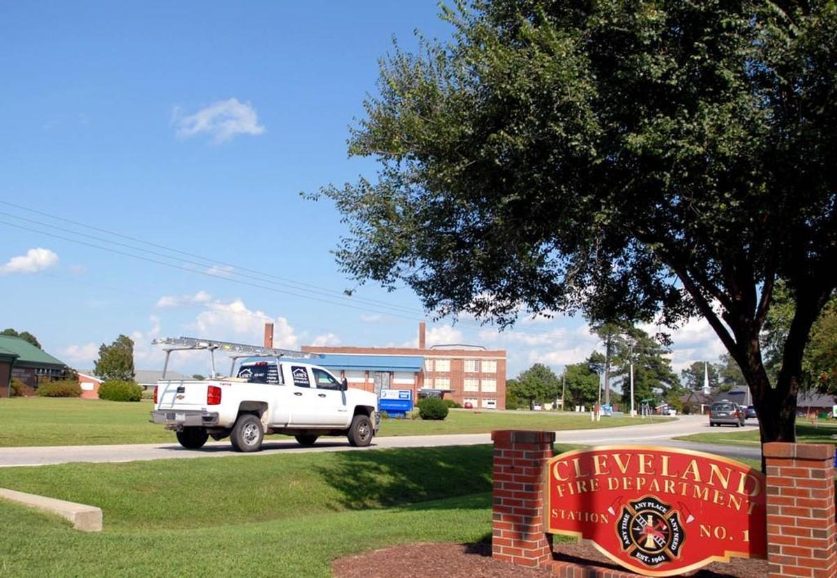 Cleveland residents drive down one of the area’s two main thoroughfairs, Cleveland Road. Other than a fire station and two small school buildings, the area is marked by open fields.