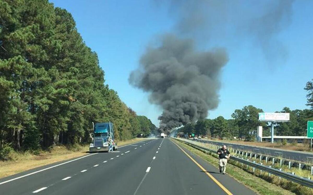 A photo taken by the Selma Fire Department shows the smoke billowing from a crashed tractor trailer on Interstate 95 Wednesday.