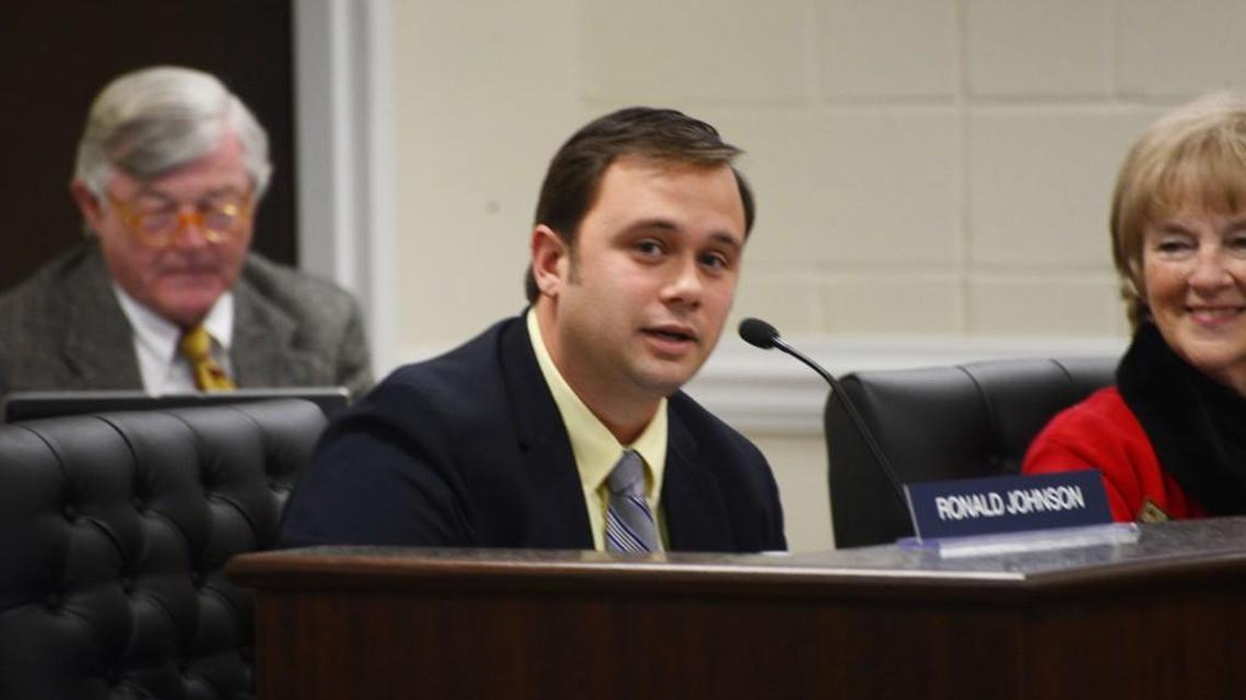 Suspended police officer now says he won’t resign from Johnston County school board