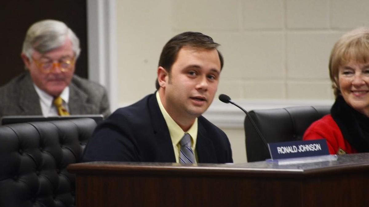 Suspended police officer now says he won’t resign from Johnston County school board