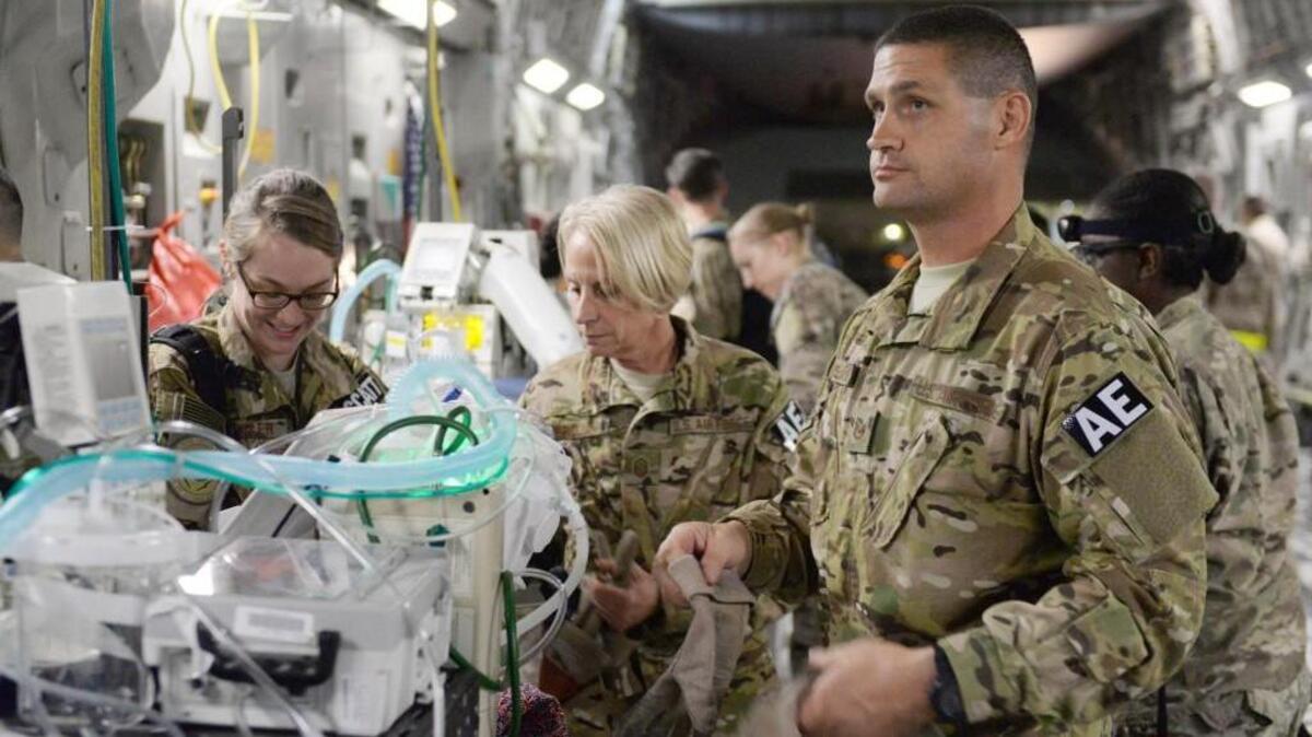 
Tech. Sgt. Russell McLamb, right, of the N.C. Air National Guard, helps load an injured service member onto a C-17 Globemaster III at Bagram Airfield, Afghanistan.
