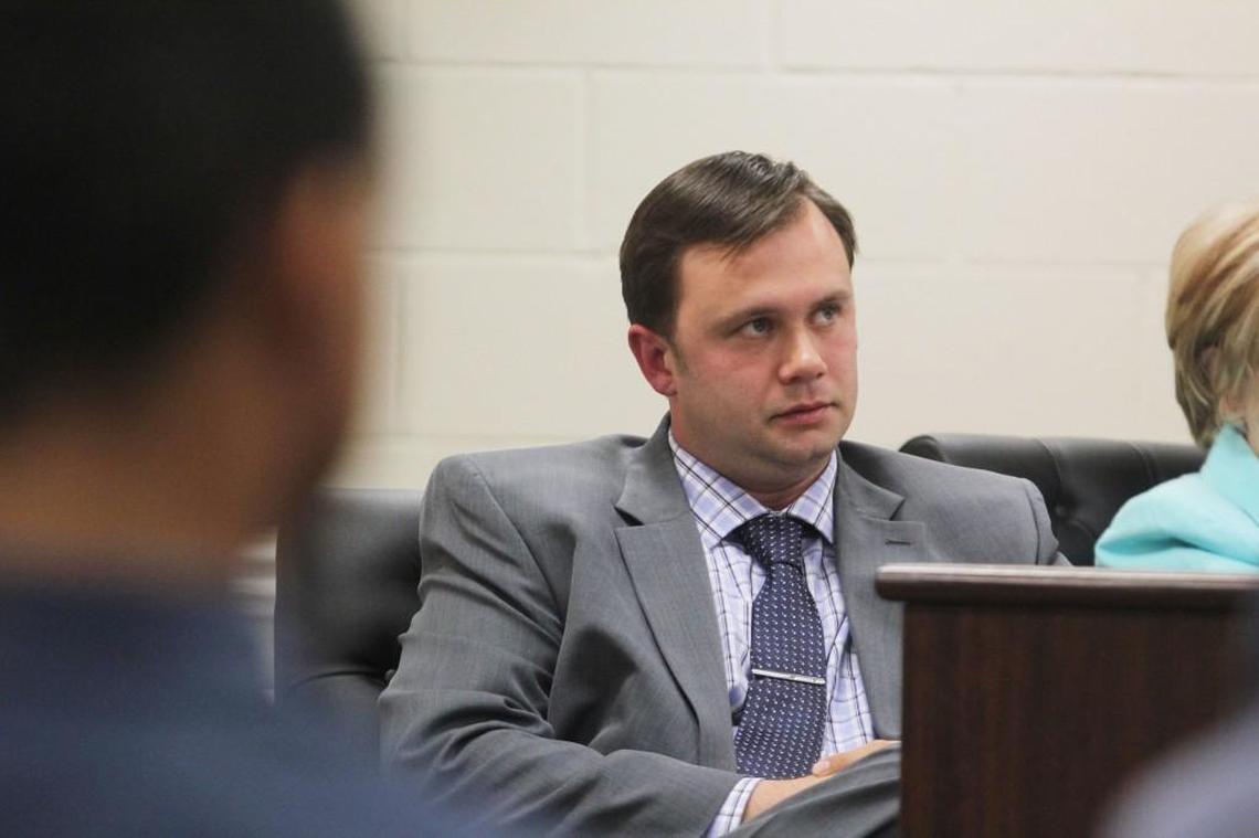 Johnston County Board of Education member Ronald Johnson listens to speakers urging the county to keep South Campus open.