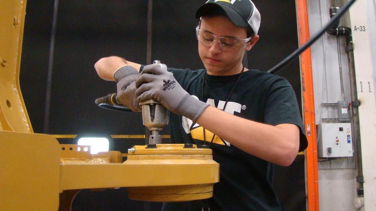 
Chase Dudley of South Johnston High School, installs a hitch plate while taking part in the Caterpillar Assembly Pre-Apprenticeship Program in Clayton.
