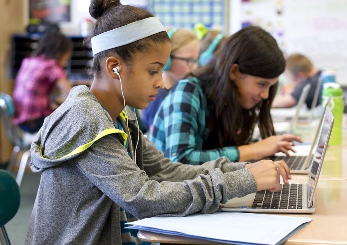 Maya Fotopoulos works on a laptop in Kim Ellison’s fifth grade language arts class at Powhatan Elementary School in Clayton in this 2015 file photo. The Johnston County school board has approved a shortened 168-day calendar for the 2024-25 school year.