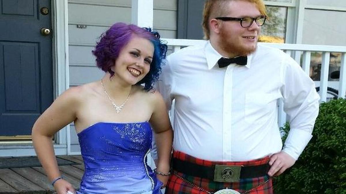 
David Leix, left, and his girlfriend and prom date, Stephanie Adams, pose for a picture before the “Praise Prom” on May 15.
