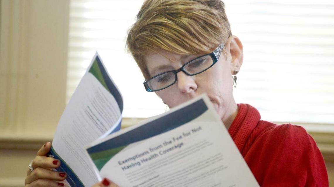 Accountant Heidi Moore of Selma reviews Affordable Care Act information during a seminar in Smithfield. Tax experts are becoming health-care experts, advising clients of credits and exemptions they might qualify for.