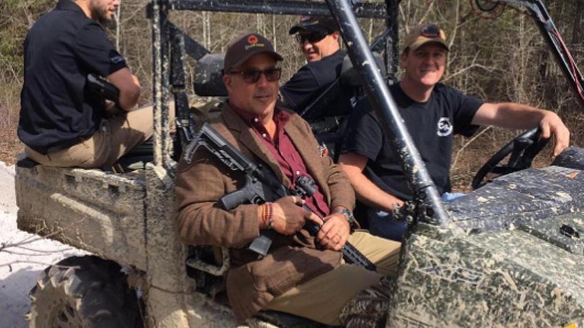 Andrew Zimmern, in passenger seat, and driver Jody Rhodes head out to look for Johnston County wild boar.