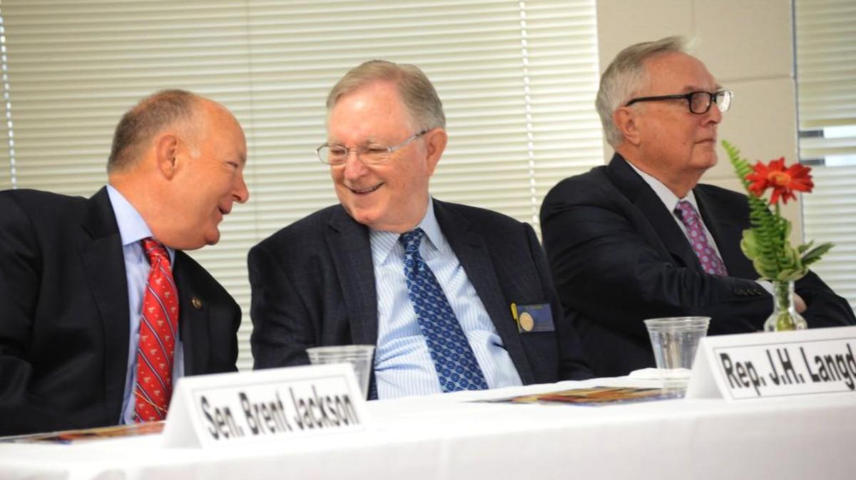 Rep. J.H. Langdon, center, shares a laugh with Sen. Brent Jackson, left. With them is Rep. Leo Daughtry. All attended Johnston County’s 2016 legislative update.