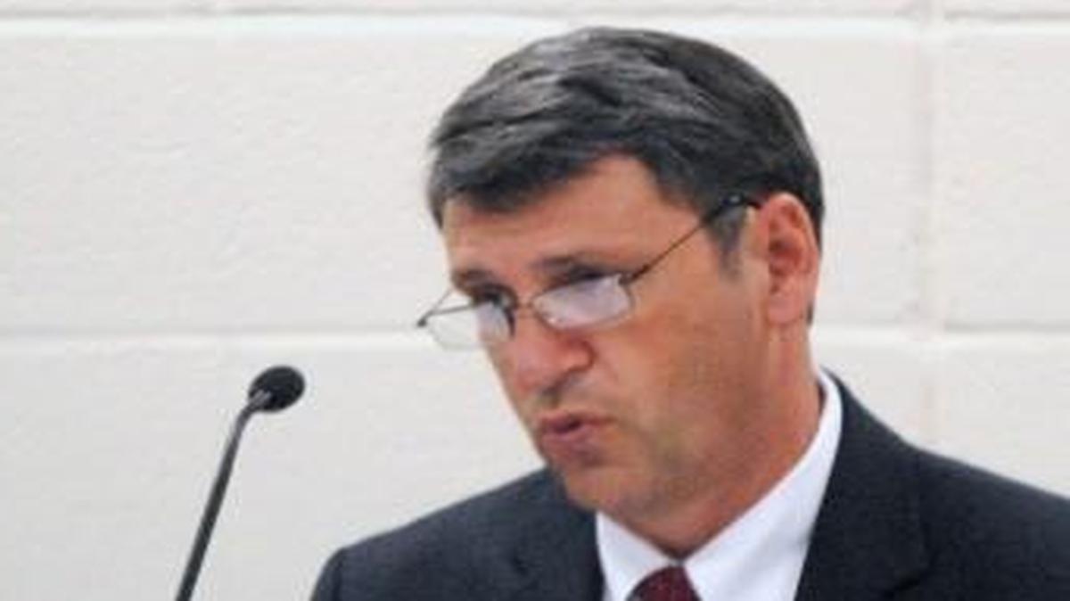 Johnston County Superintendent Ed Croom addresses the Board of Education May 20, 2015. School board member Donna White of Clayton is on the right.