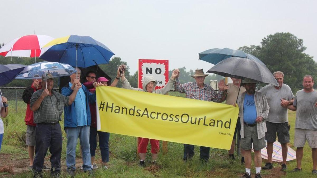 
More than a dozen Johnston County landowners joined hands on Tuesday in protest of the Atlantic Coast Pipeline.
