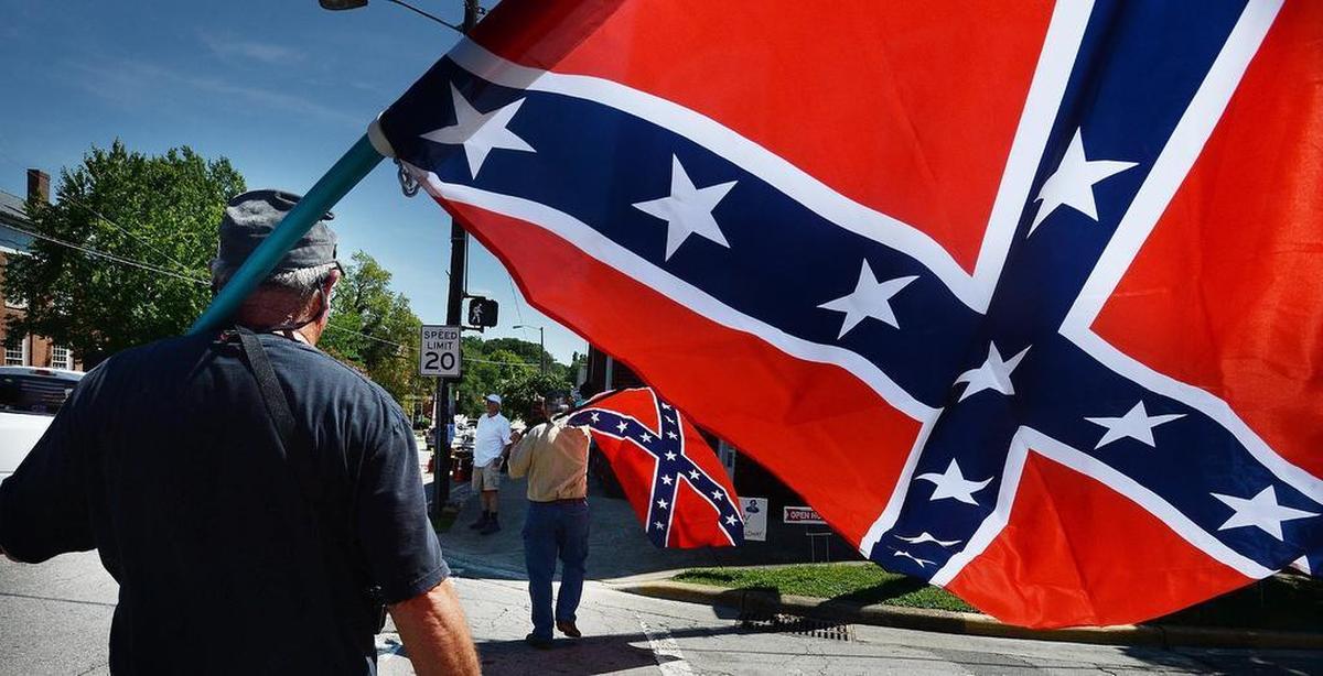 Small groups of people bearing Confederate flags have demonstrated in Hillsborough in recent years in response to efforts to remove signs of the Confederacy from the town and local school district. Tensions have escalated around a local chocolate maker’s chalkboard sign in response.
