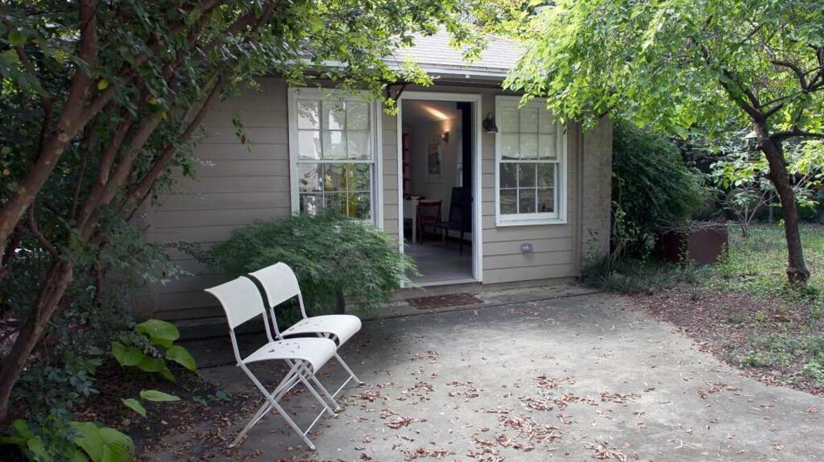 A small cottage behind the home of Robin Abrams and her husband Simon Atkinson on Forest Road in Raleigh. Current law makes it difficult for most homeowners to gain approval for such backyard structures known as accessory dwelling units (ADUs) or “granny flats.”
