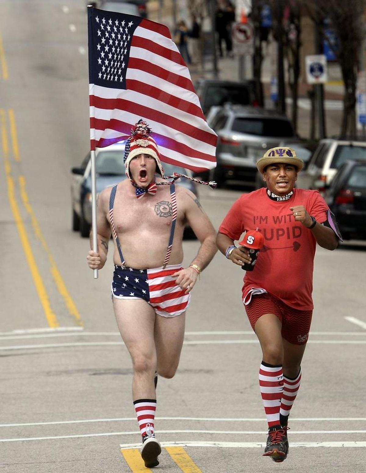 Matt Nordin, (left) of Virginia Beach escorts Allen Thompson, of Raleigh in to the finish line during the Cupidâs Undie Run in Raleigh, N.C. Saturday, February 20, 2016. Thompson was the last runner in as several hundred runners took part in the charity event which raises money for the Childrenâs Tumor Foundation. CTF is the worldâs largest non-government organization dedicated to ending Neurofibromatosis through research.