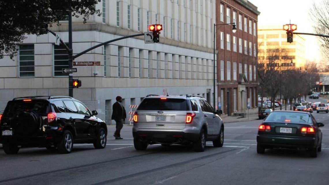 Traffic stops at the double red lights, known as “T” heads to traffic engineers, at the intersection of Wilmington and Morgan streets in downtown Raleigh on Monday evening. The City of Raleigh brought back these fixtures in 2012 to try to reduce red light runs at certain intersections. There are now four of them downtown, with the most recent installed Jan. 12.