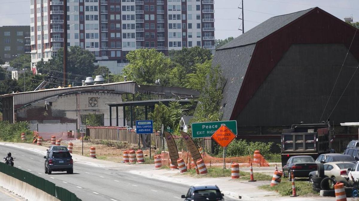 Demolition of the City of Raleigh’s garage and maintenance facilities is underway, right, between Wade Avenue and Peace Street. Crews are tearing down city-owned buildings along Capital Boulevard, the first step in a plan to create a park and greenway on the northern end of downtown Raleigh.