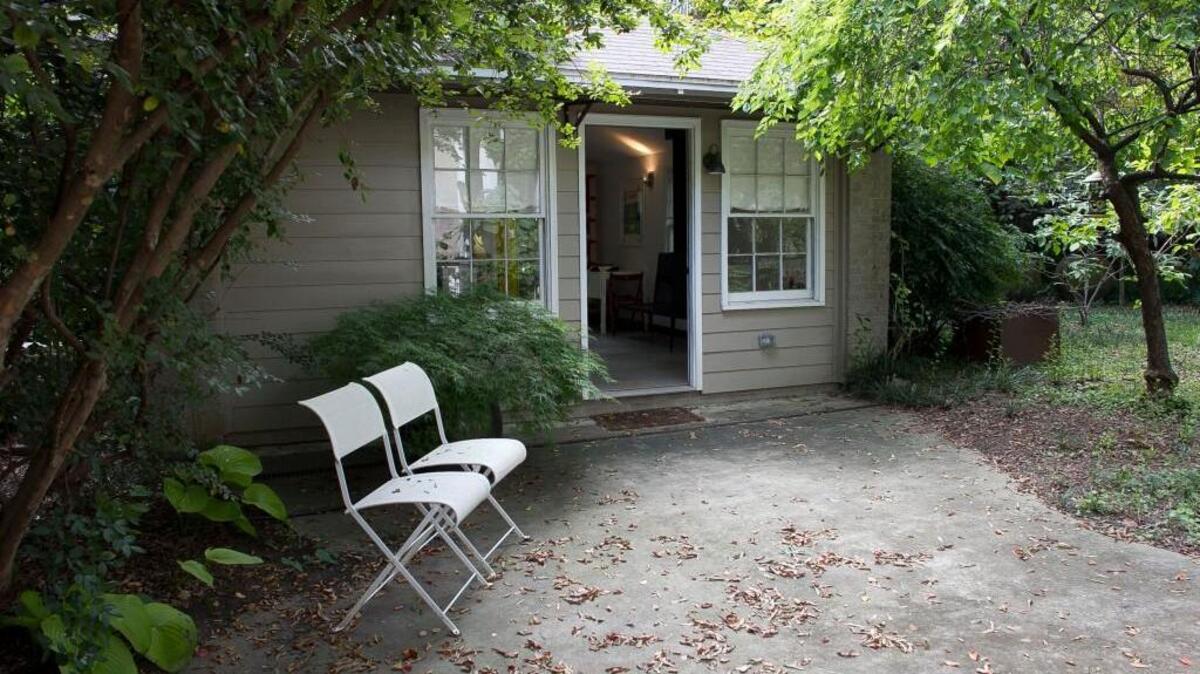 Robin Abrams and her husband Simon Atkinson have a small cottage behind their home on Forest Road in Raleigh.