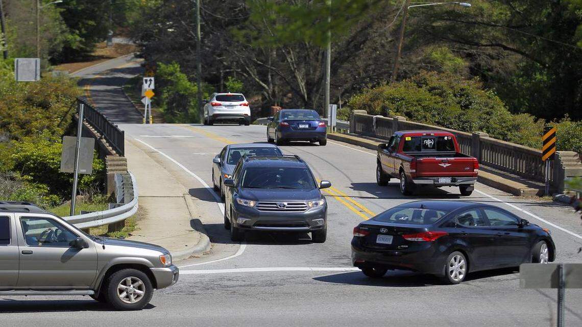
Vehicles navigate the intersection where Pullen Road dead ends into Western Boulevard in Raleigh on Wednesday. The future Pullen Road extension will run from Pullen/Western south through the woods, hitting Bilyeu and then heading west to Centennial Parkway.
