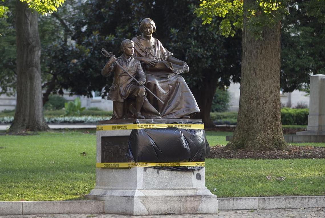 Black plastic and police tape cover the vandalism to the Women of the Confederacy monument on the State Capital grounds on Tuesday morning July 21, 2015 in Raleigh, NC. The vandalism was discovered overnight and was covered by daybreak. The statue is located along the Dawson Street side of the Capital.