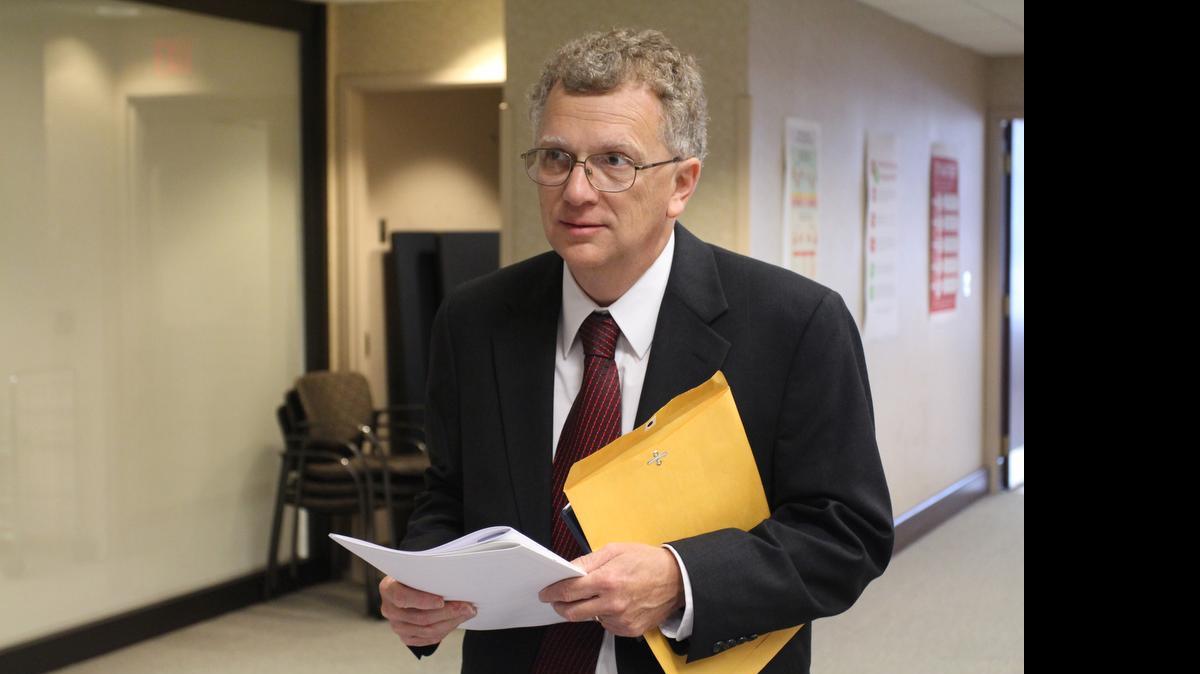 
David Cox, a vocal opponent of large commercial development in North Raleigh, arrives to applause at the Wake County Board of Elections office on July 14, 2015. He filed for a seat on the Raleigh City Council and will challenge incumbent John Odom.
