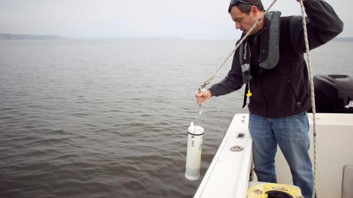 Cary and Apex are buying a $4.1 million aeration system to address Jordan Lake’s inconsistent water quality. They will use the ResMix system, manufactured by the Australian firm WEARS. The system will circulate water near the intake, just north of where U.S. 64 crosses Jordan Lake, disrupting water stratification that occurs in the summer. In this 2014 photo, Jason Green, environmental program supervisor with N.C. Department of Environment and Natural Resources (now Department of Environmental Quality) takes a water sample from Jordan Lake.