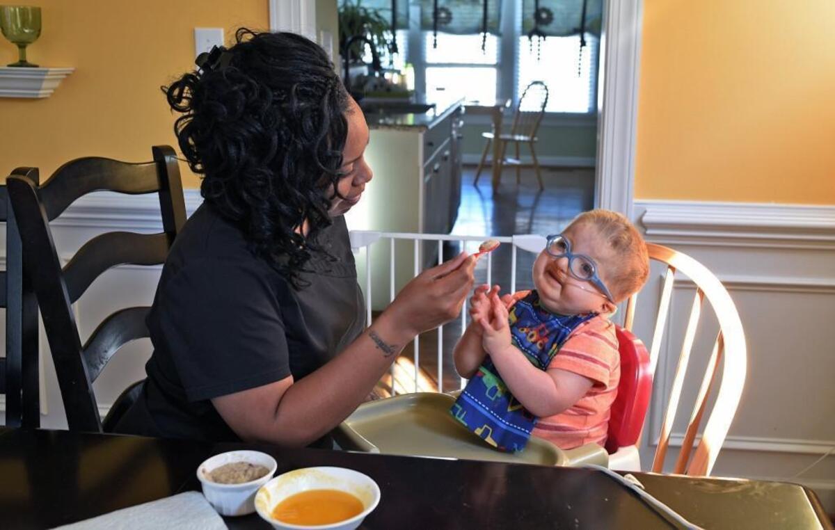 Porsche Thompson, an in-home nurse care provider, tries to get Tommy Yellin, 5, to eat his breakfast in Cary on Wednesday, June 28, 2017. Tommy, the son of Lori Palen and Wes Yellin, requires a feeding tube, oxygen tank with concentrator, surgeries, costly medications and an in-home nurse. Tommy is one of 2,300 children in North Carolina whose medical costs are covered through a Medicaid program for the medically fragile. Parents of these children worry that Medicaid cuts in the U.S. Senate’s proposed ACA repeal could cause state officials to cut funding for the program.