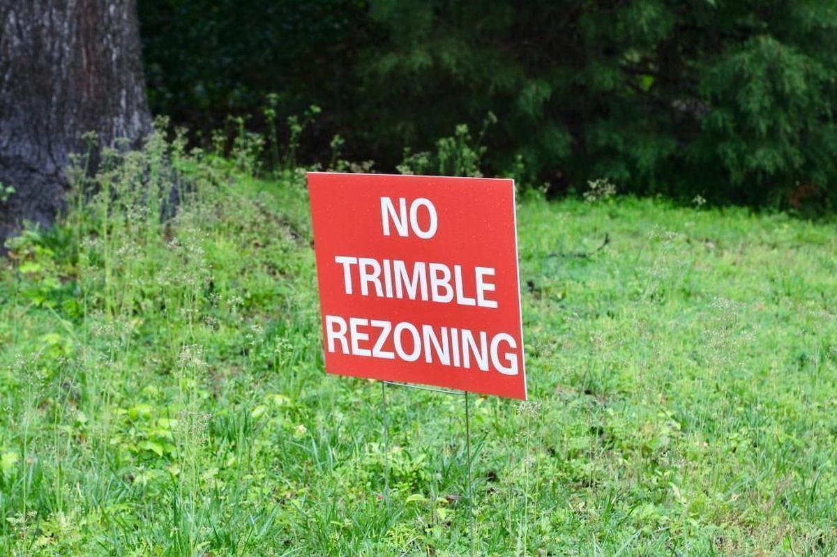 Residents of the Scottish Hills neighborhood have made yard signs to protest the potential rezoning of 2.6 acres at the edge of their neighborhood, where Habitat for Humanity of Wake County wants to build nine affordable homes.