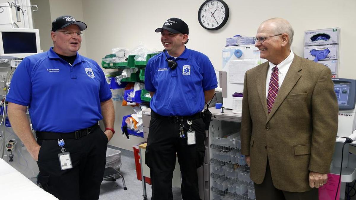 Michael Weddington, right, a 75-year-old Raleigh lawyer, had a heart attack in June meets with the two paramedics who treated him, Dean McMorrine, left, and Donald Robinson, at UNC Rex, where Weddington was treated, on October 5, 2016. In August, an extensive study about a pilot program coordinating communication betweens EMS providers and hospitals when treating heart attack victims in 16 different regions was released. The results showed that effective communication tends to cut down time between the heart attack and treatment, which can save a patient's life. Several local doctors were involved in the research, and Wake County is one of the best in the U.S. with coordinating these efforts.