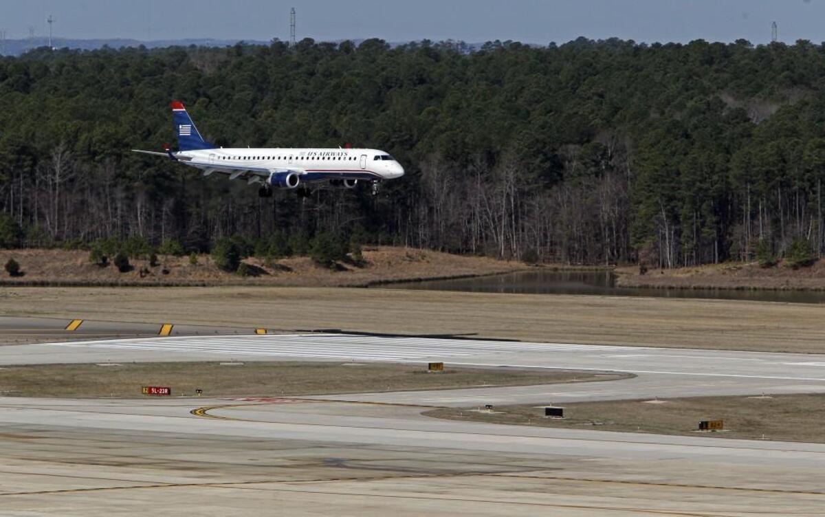 A plane lands at Raleigh-Durham International Airport. File Photo