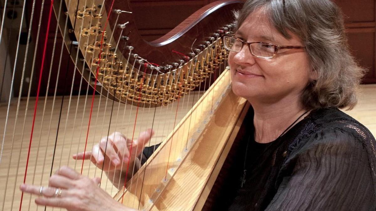 Anita Burroughs-Price, harpist with the North Carolina Symphony, performs for those who need solace.