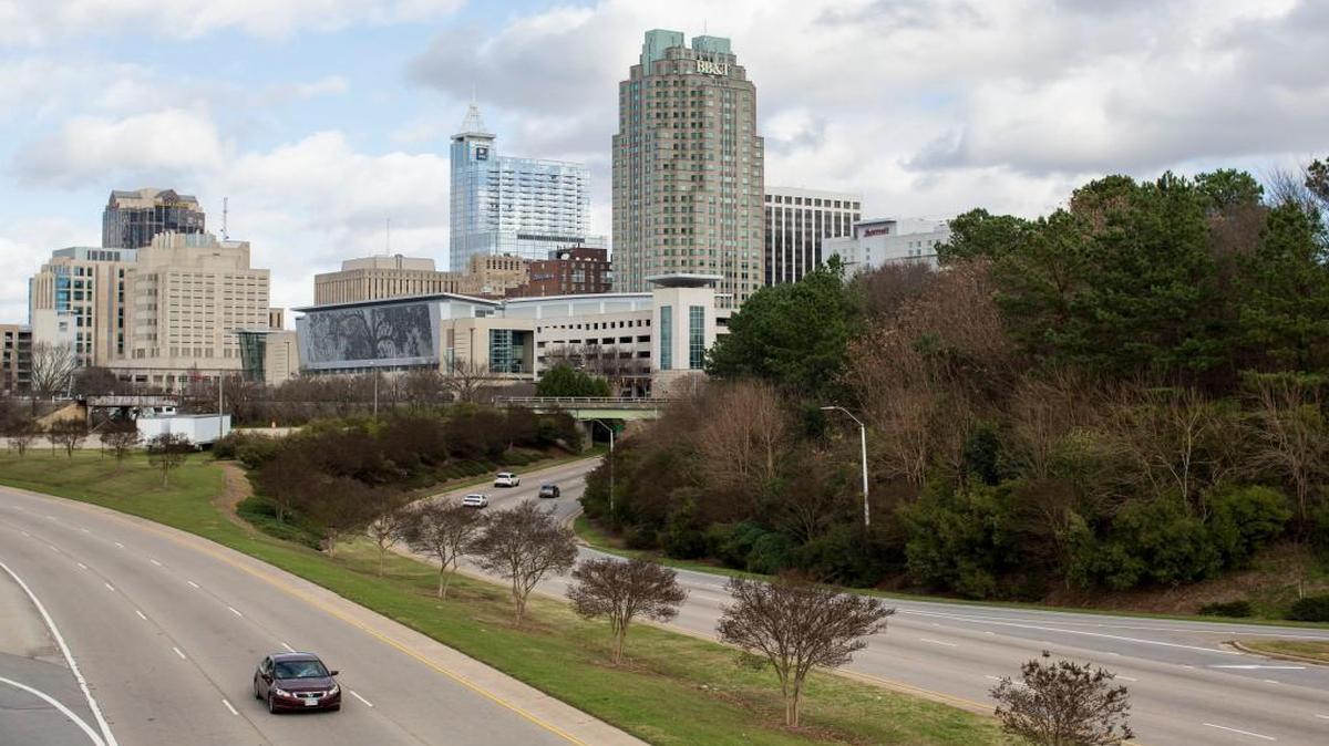 The downtown Raleigh skyline is seen from the Martin Luther King Jr. Blvd. overpass. A vision plan that the Raleigh City Council approved in September envisions a sports stadium south of the Raleigh Convention Center, roughly the foreground area of this photograph.