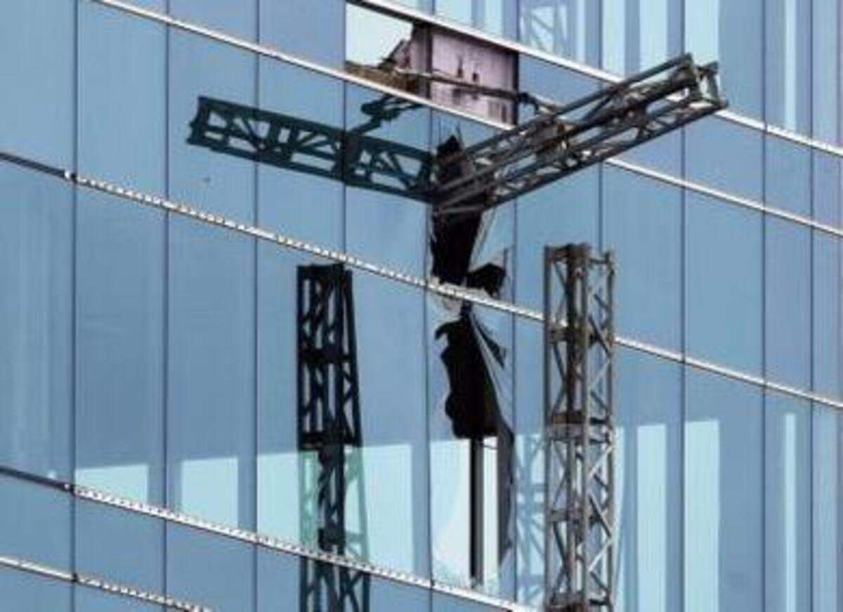 
A broken piece of scaffolding, right, juts from the Charter Square project after a collapse Monday, March 23, that left three workers dead and another seriously injured in downtown Raleigh. 


