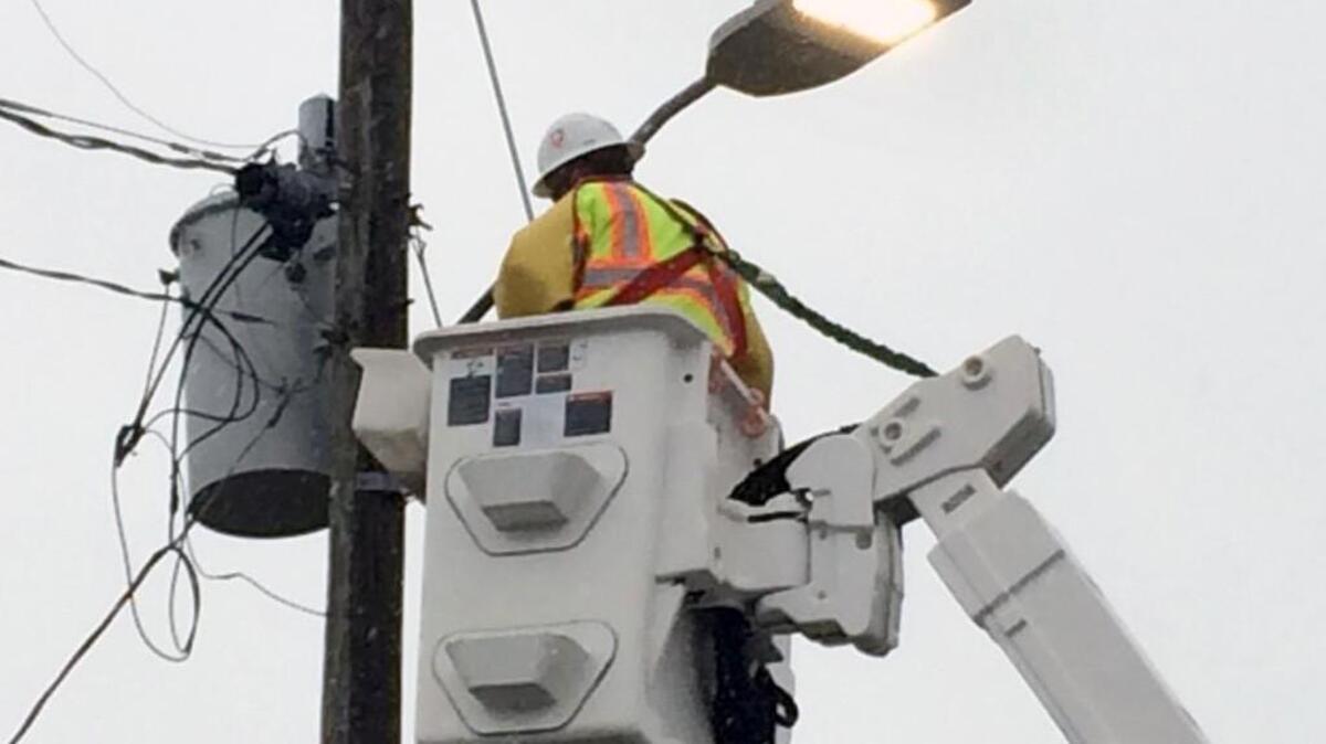 
A worker with American Lighting and Signalization turns on a new light-emitting diode or LED streetlight fixture on Beryl Road in Raleigh on Tuesday, Sept. 29. American Lighting and Signalization is a contractor for Duke Energy, which owns the fixtures and leases them to the city.
