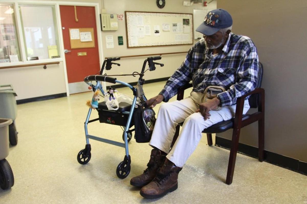 Wayman Turner, 87, reaches into his “Star Wars” lunchbox, where he keeps his medications. Turner grew up in Johnston County and spent 39 years in Philadelphia before returning to Raleigh in 1993. He lives at Wintershaven Apartments and now must find a new new place to live.