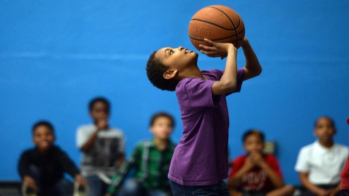 Steven Bullock, 9, shoots baskets at the Wake County Boys and Girls Club on Raleigh Road in Raleigh Wednesday, March 2, 2016.