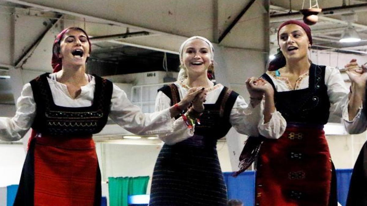 
Teenagers from the Holy Trinity Greek Orthodox Church of Raleigh opened the dancing entertainment onstage with a Thracian traditional folk dance and song at 3pm in the Jim Graham Building, State Fairgrounds Saturday, September 12, 2015 during the second day of the three day Raleigh Greek Festival. Thousands of visitors packed the Jim Graham Building on the State Fairgrounds sampling Greek food, culture and music during the 32nd annaul three day Raleigh Greek Festival. 
