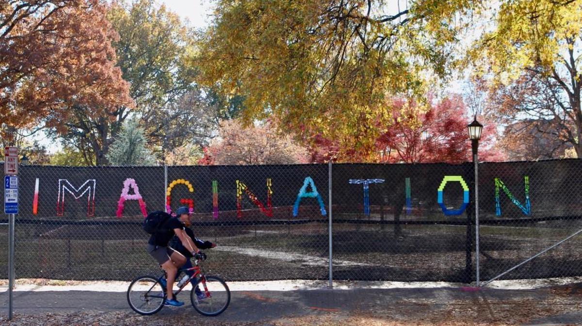 Raleigh reached out to local artists and art groups for help decorating the construction fencing surrounding Moore Square. The first of four installations stretches across the square’s Hargett Street boundary. In full, it reads: “Logic will take you from A to B, but imagination will take you anywhere.”