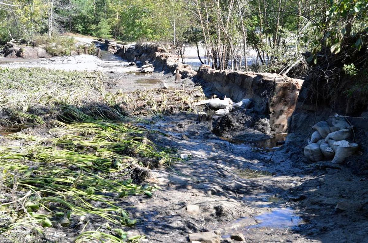 A view from behind the dam at Little River Park in Zebulon, N.C. Wednesday, Oct. 12, 2016. The area pictured left was a pond before rains from Hurricane Matthew caused the river to breach the barrier.