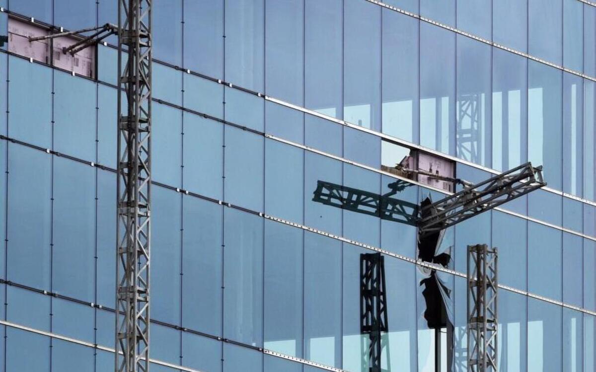 
A broken piece of collapsed scaffolding mast (right) that held a work platform that fell killing three workers and seriously injuring one at the Charter Square project in downtown Raleigh. A second, intact mast is at left.
