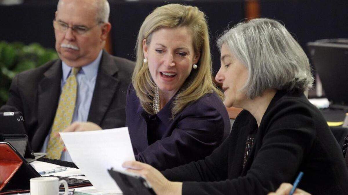 Wake County Commissioner Caroline Sullivan, center, on Monday asked a federal judge to reopen the candidate filing period for three commissioners districts so she can run to keep her seat on the board.