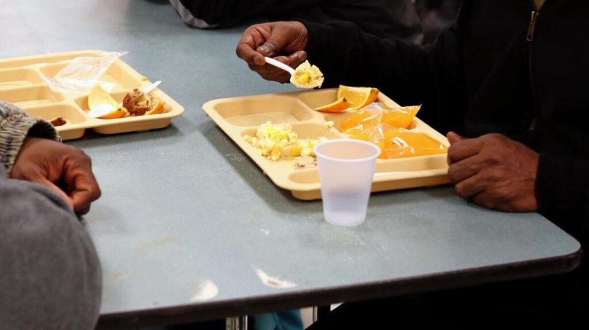 Guests of the South Wilmington Street Center eat breakfast on Sunday, Jan. 8, 2016.
