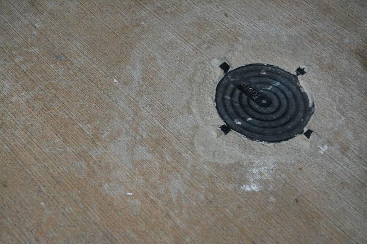 Parking sensors are embedded in the cement floors of a parking garage at the Cary Town Hall campus.