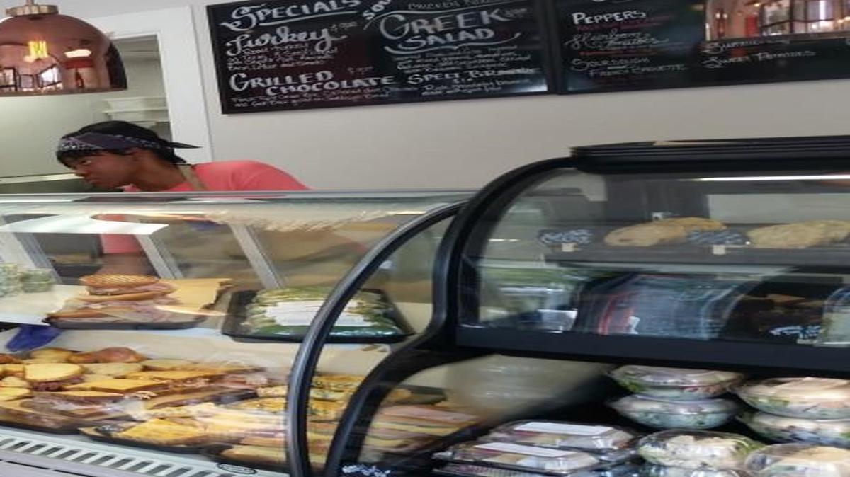 A customer makes a selection at Carroll’s Kitchen in downtown Raleigh, a new grab-and-go restaurant that employs women who have struggled with homelessness.